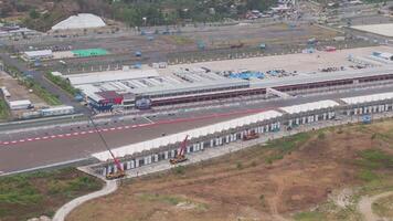 Aerial view of a motorsport circuit pit lane in Lombok, Indonesia video