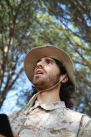 Military Instructor Spurns Student Soldiers For Bad Running Results In The Woods Vertical View photo