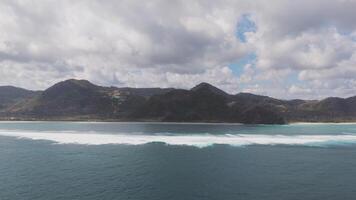 Aerial view of the ocean with rolling waves near Lombok, Indonesia video