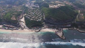 Aerial view of Melasti Beach with cliffs and turquoise waters, Bali video