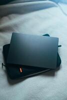 Flat lay view of desktop laptop above case. Workplace with empty space for text. photo