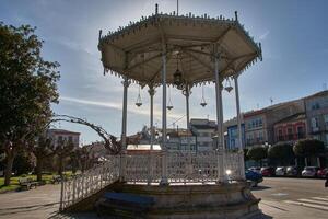 A view of the iconic music kiosk in Vegadeo, Asturias, Spain, under a bright, sunny sky. photo