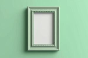 Green picture frame isolated with copy space. Empty vertical pastel green frame or border on green wall. photo