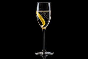 A glass of champagne with a lemon slice in it photo