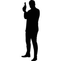 Silhouette Of A Secret Agent Holding A Gun In A Defensive Stance vector