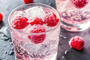 Raspberry lemonade with ice and raspberries photo