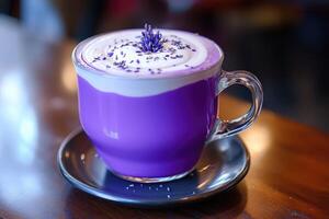 A purple drink with whipped cream and lavender on top photo