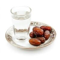 Refreshing Water and Sweet Dates on Ornate Plate Healthy Iftar Meal Ramadan photo