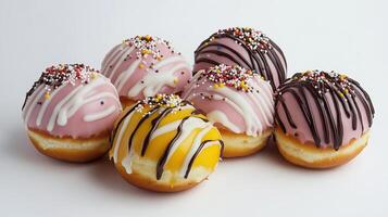 Five donuts with sprinkles on a white background photo