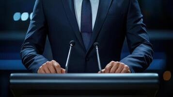 In a medium closeup the politicians intense gaze is framed by the structured lapels of their fitted suit conveying readiness and charisma. Their hands rest firmly on the podium reflectin photo