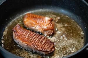 rosted duck breast in a frying pan photo