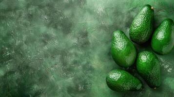 A Symphony of Emerald Green Avocados on a Textured Surface photo