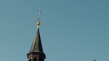 crucifix stands tall on the bell tower video