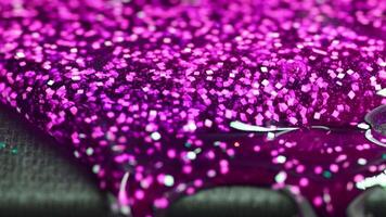 Abstract background with blurred, iridescent pink circles gently descending. They shimmer and subtly change in color, creating a soft, ethereal, and mesmerizing visual effect. video