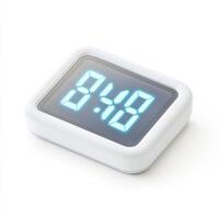 Compact digital alarm clock displaying bright numbers in a modern design for accurate timekeeping photo