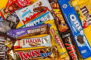 Lviv Ukraine. 04.02.25 Colorful assortment of popular chocolate bars and candies photo