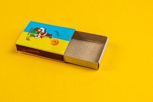 Lviv Ukraine 04.02.25 Colorful cartoon matchbox on bright yellow background photo