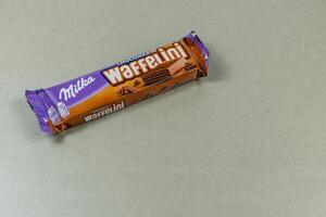 Lviv Ukraine 04.02.25 Waffelini chocolate snack placed on a gray table photo