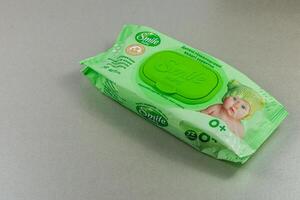 Lviv Ukraine 04.02.25 Baby wipes package on gray surface showing green design photo