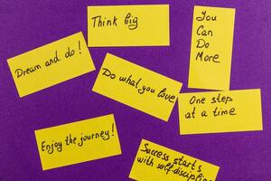 Encouraging quotes on sticky notes for personal motivation and growth photo