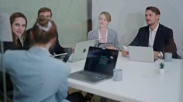 Business meeting with professionals discussing strategy and sharing insights in a modern office setting video