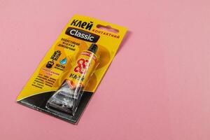 Lviv Ukraine 04.02.25 Glue package on a pink background for crafting activities photo
