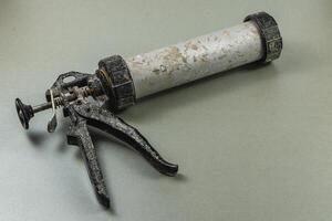 Tool for sealing and applying adhesive in workshop setting photo