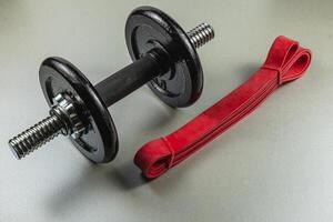 Gym equipment with weights and resistance band for workout photo