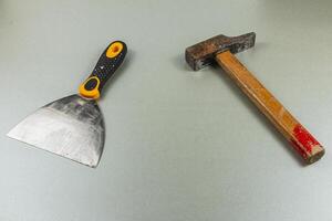 Tools for home renovation project on a gray surface photo