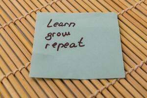 Notes on growth and learning with motivational phrases displayed clearly photo