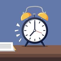 Classic round alarm clock with yellow bells ringing on wooden surface in flat design style illustration vector