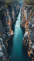 A river flowing through a gorge in the middle of a canyon photo