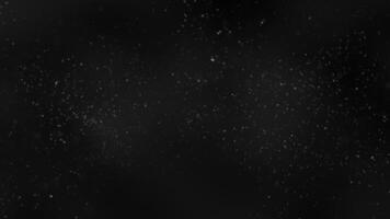 Real dust particles flying in the air. Dust particles background and beautiful bokeh on dark background. Slow motion macro shot. Seamless looping 4k . video