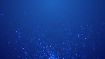 Shiny light blue particles flying up, abstract background, shimmering particles with bokeh effect video