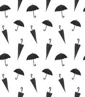 Seamless pattern of doodle sketch umbrellas isolated on white background vector