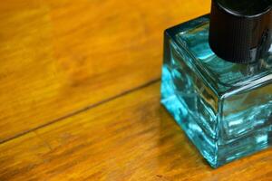 Stylish Perfume on Rustic Wooden Surface Closeup photo
