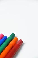 Neatly Lined Up Colorful Crayons on White Surface photo
