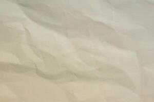 Crumpled paper as background creased craft paper texture blank paper sheet photo
