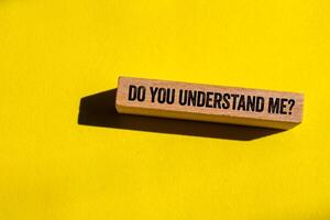 Do you understand me message written on wooden block on yellow background. Conceptual do you understand me symbol. Copy space. photo