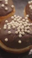 Delicious chocolate dessert topped with crispy pearls in bakery video