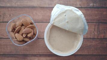 almond nut and yogurt in a container on table video