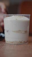 Enjoying a layered dessert in a cozy cafe setting video
