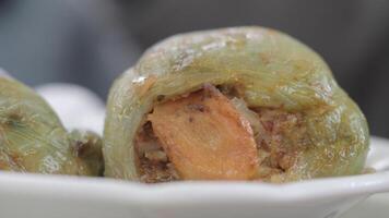 Delicious stuffed peppers served in culinary event video