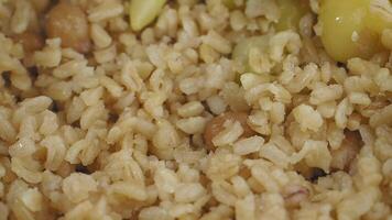 Delicious rice dish preparation in a traditional kitchen setting video