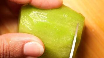 closeup of cutting kiwi on a chopping board video