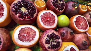 Fresh fruit display featuring pomegranates and citrus in autumn video