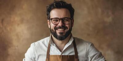 A man with glasses and beard in a white shirt and apron photo