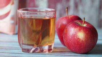 apple juice and fresh apple on a table video