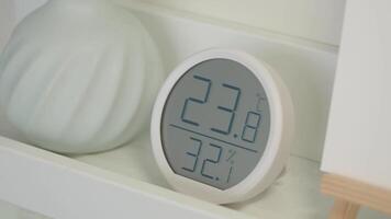 Digital temperature and humidity display in a modern interior setting video