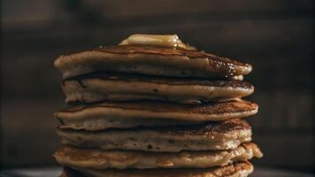 Stack of pancakes with butter and syrup photo
